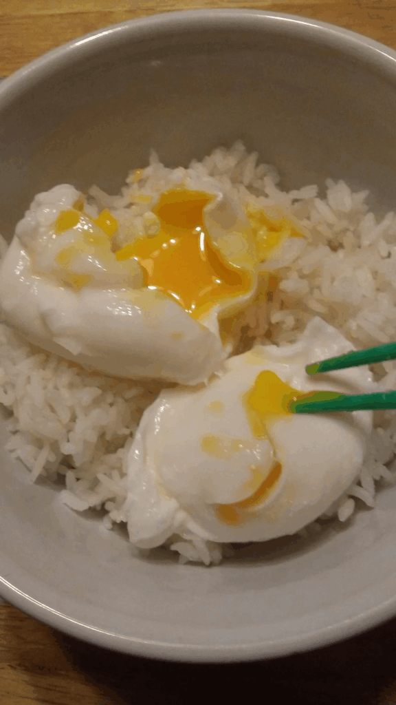 Poached eggs over plain rice. My favorite sick food.