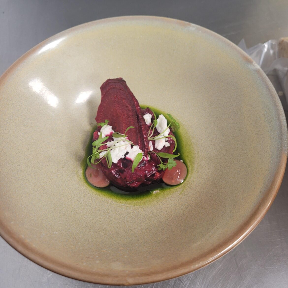 Beet Tartare with a walnut/mint oil and a beet fluid gel, topped with chevre, chervil, and a beet chip