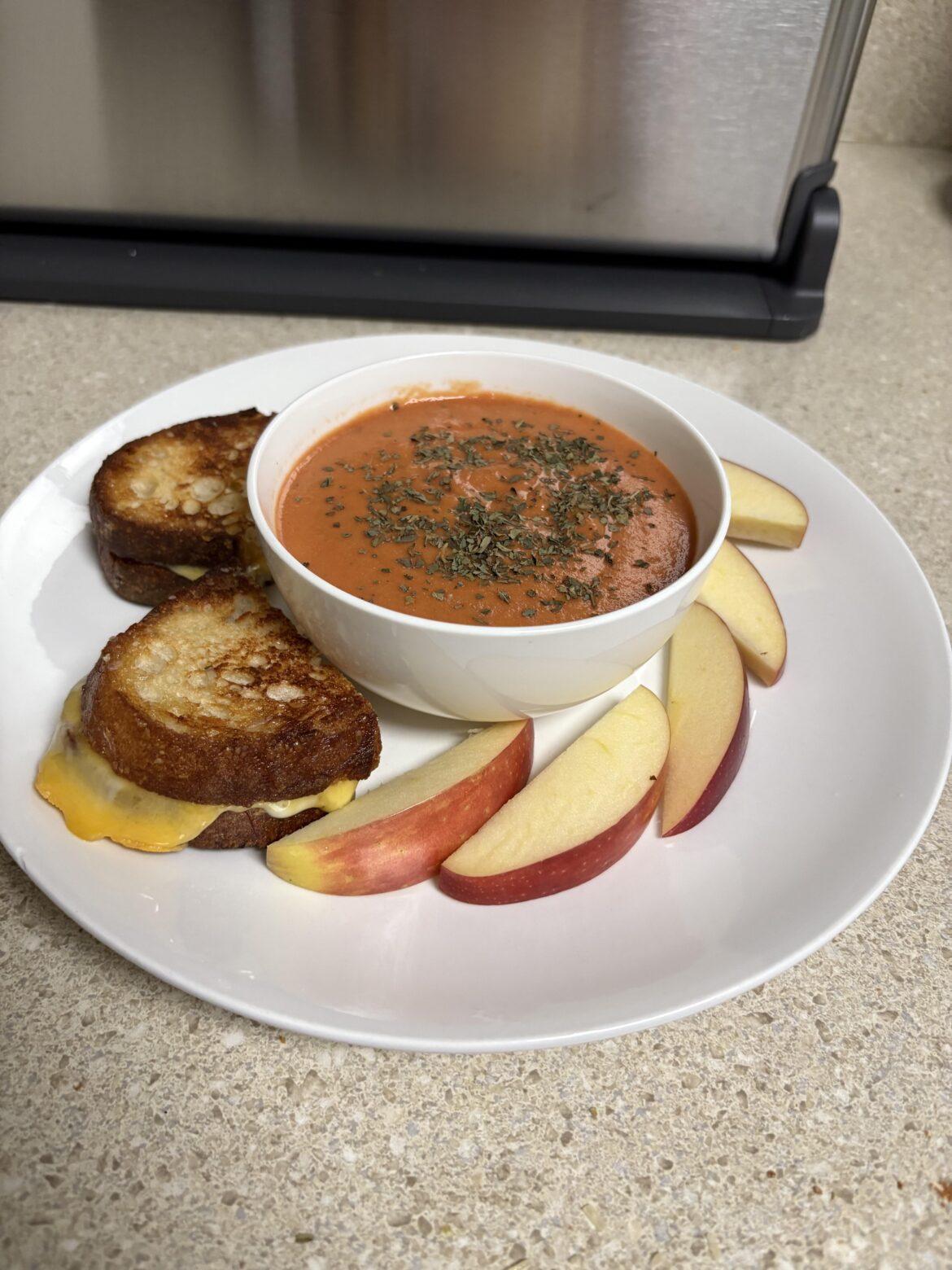 Homemade grilled cheese w/ homemade tomato soup.