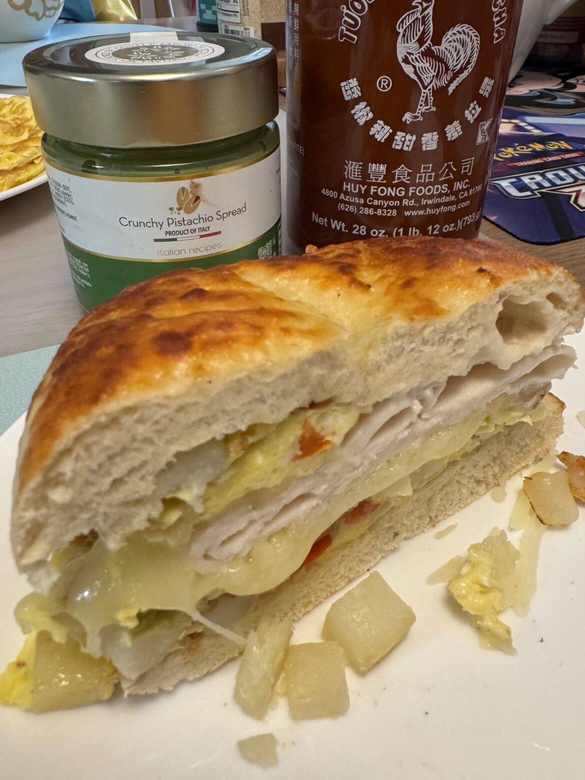 2 Eggs, Turkey, Stir Fried Potatoes, Quesadilla Cheese on Asiago Bagel