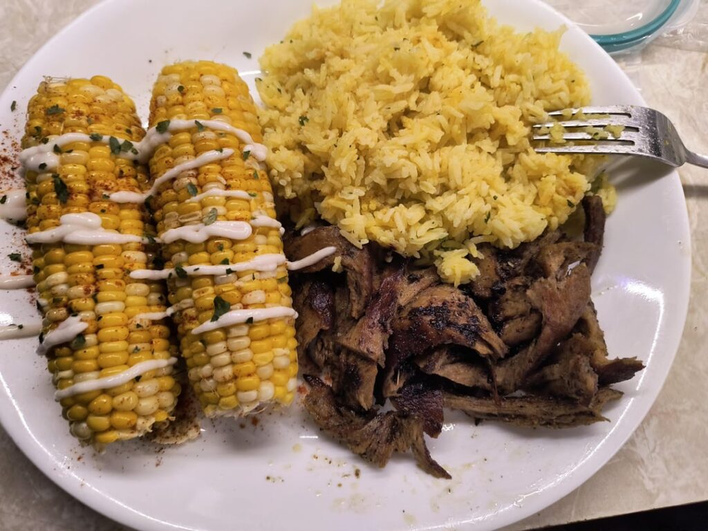 This is what it looks like when I quickly reheat leftovers after work. I made some shredded chicken last week. Served here with corn, curry rice, and jerk seasoning