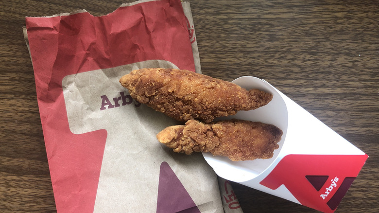 Order of two Arby's chicken tenders on the chain's packaging