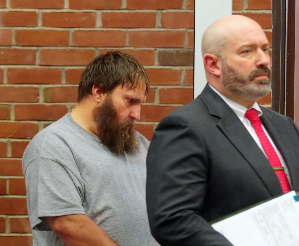 Andrew Horsman, 41, of Middleboro, left, stands with his attorney Joshua J. Wood. Horsman was ordered held without bail in Wareham District Court on Monday, June 30, 2025, on a charge he murdered his mother's boyfriend, Paul Pomerleau, 66, of Middleboro.