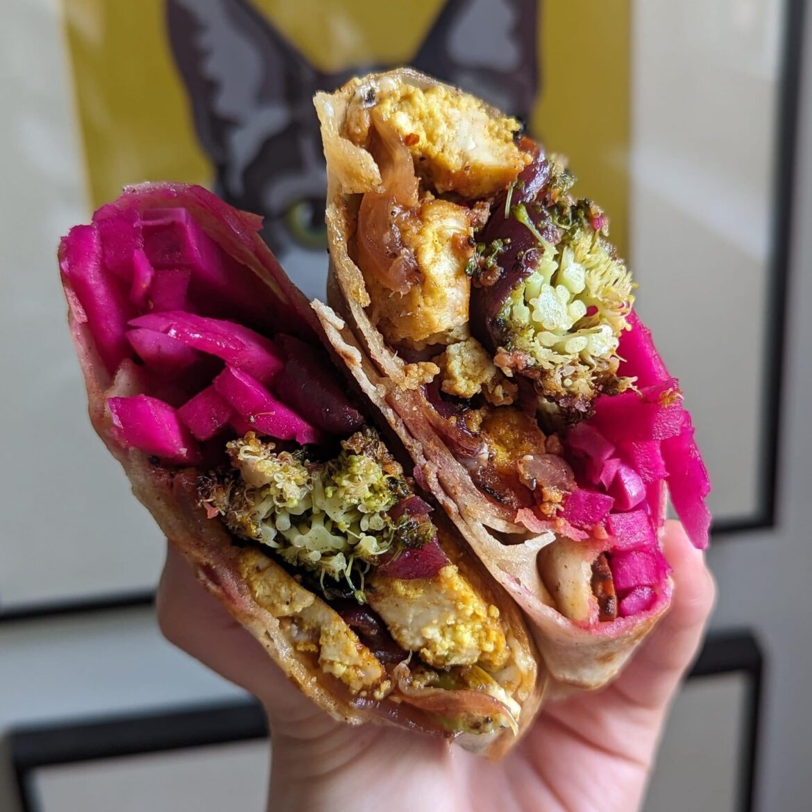 tofu shawarma wrap with za'atar broccoli, garlic sauce, and extra pickled turnips.