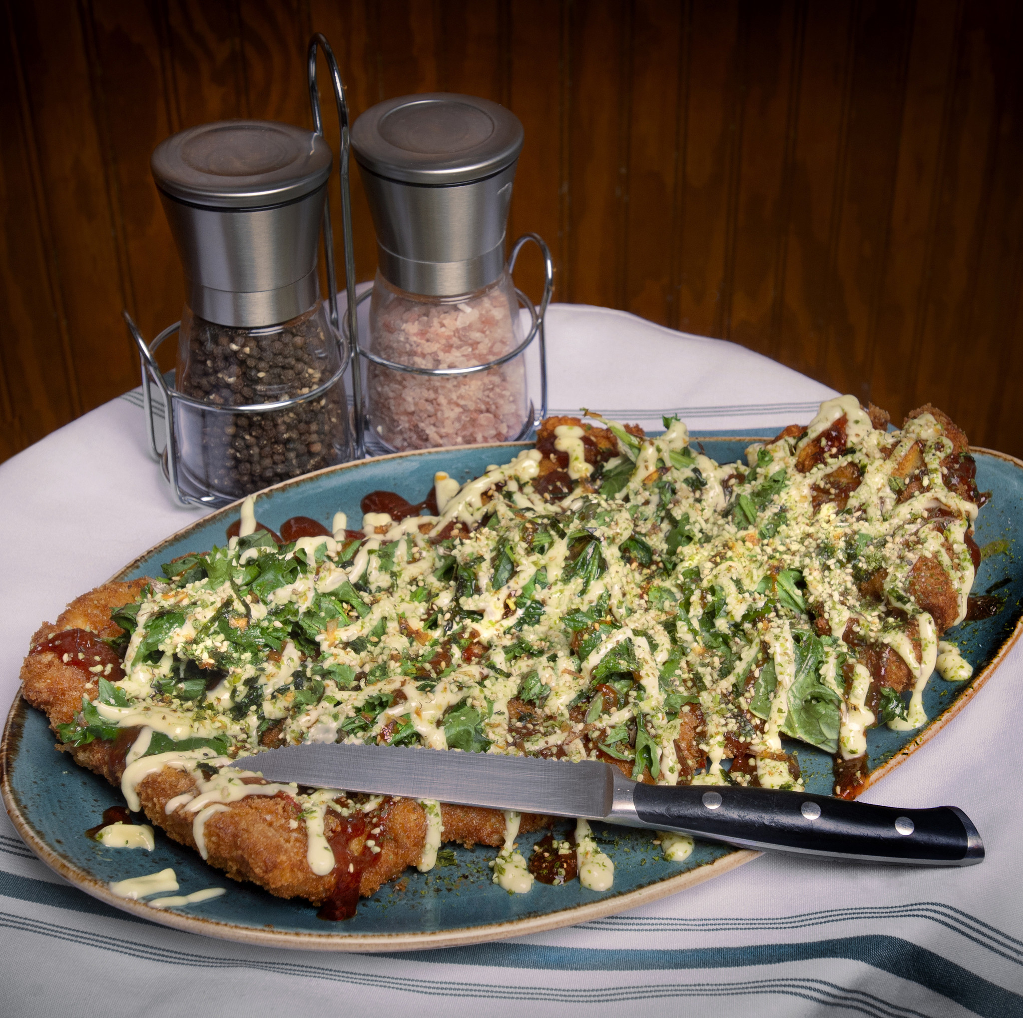 The 16-ounce Pork Katsu, with kale and Japanese Kewpie mayonnaise, is meant to be shared by two or more.