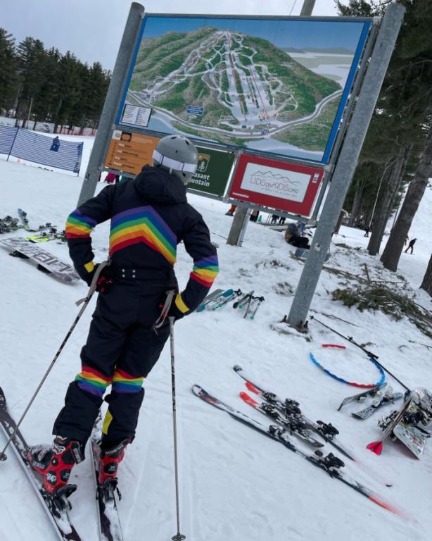 A young skier checks the trail map at Pleasant Mountain in Maine