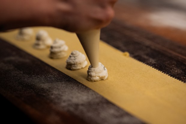 Executive chef Bailey Sullivan fills the pasta with sheep's milk...