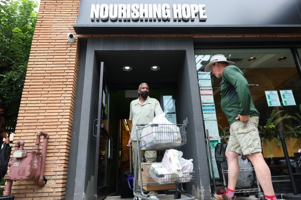 Client Oscar Glass exits with a cart of groceries at the Nourishing Hope's Sheridan Market, 3945 N. Sheridan Rd., July 10, 2025, in Chicago. (John J. Kim/Chicago Tribune)