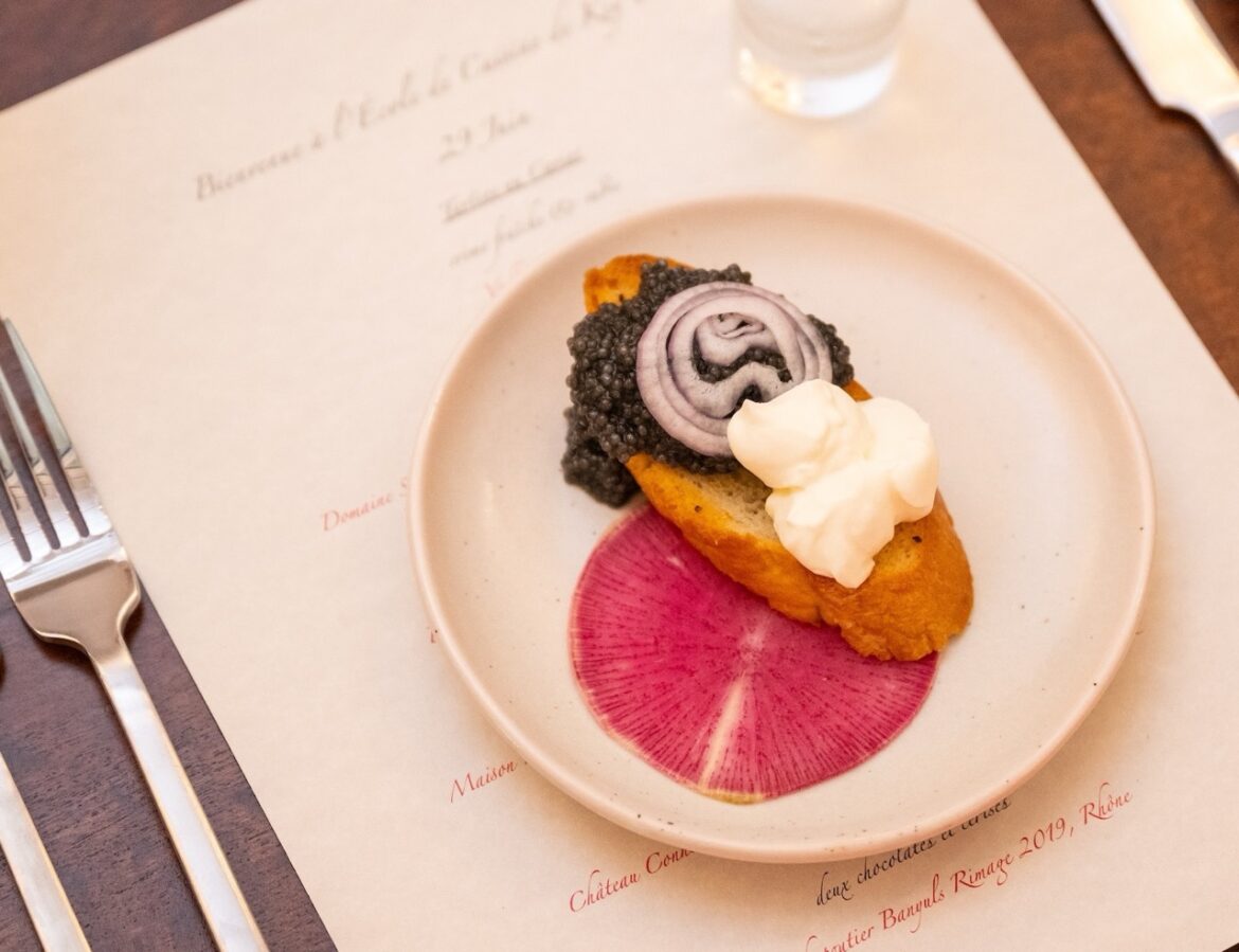 WHAT’S COOKING KEY WEST? CULINARY ADVENTURES SEASON KEY WEST’S SUMMER a white plate topped with food on top of a table