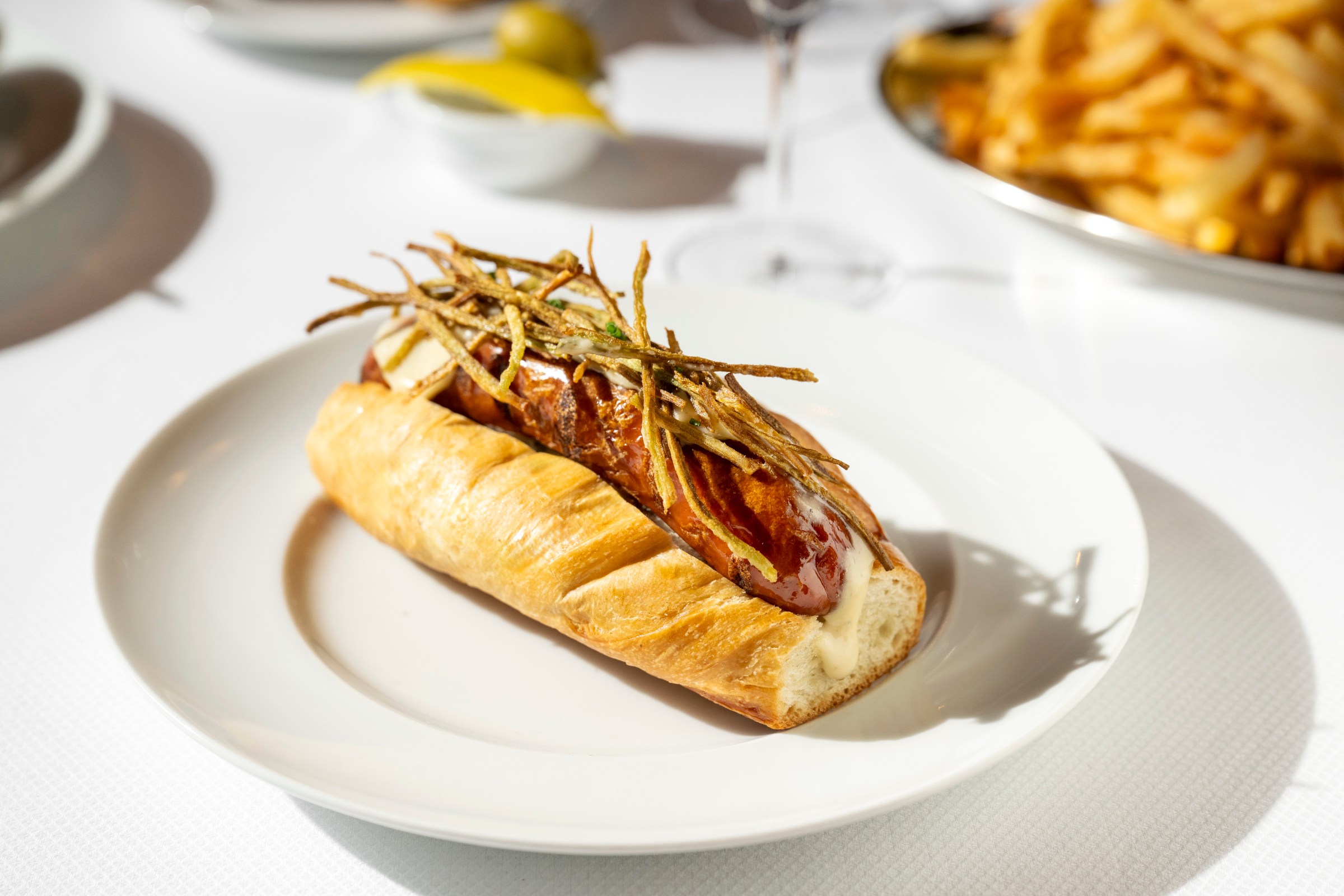A hot dog on a plate.
