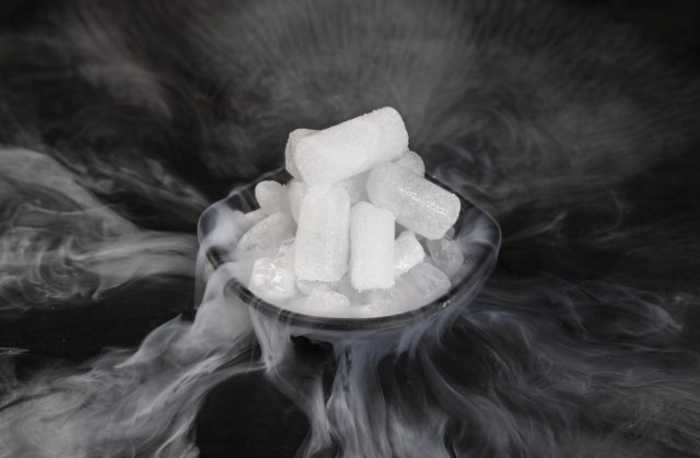 Dry ice with fog on a black background