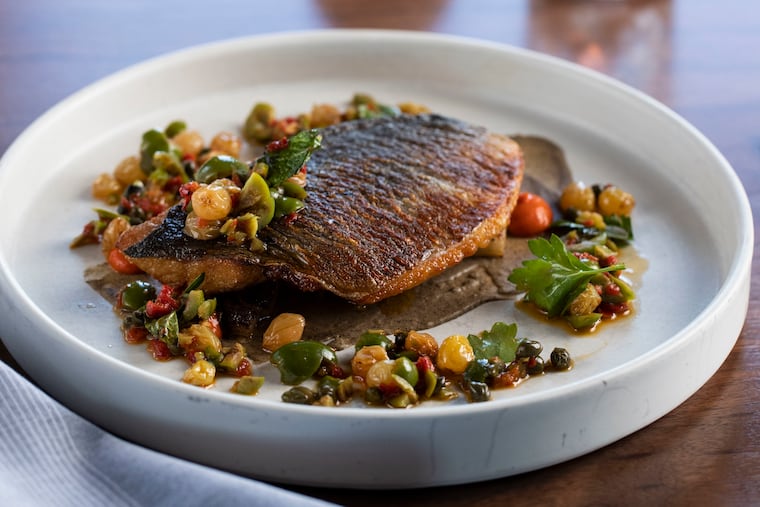 Lark The roasted dorade with braised fennel, caponata, calabrian chili and golden raisin, at Lark in Bala Cynwyd, PA on Thursday, August 11, 2022. Lark is located at Ironworks at Pencoyd Landing, on the top floor of the Residence Inn.