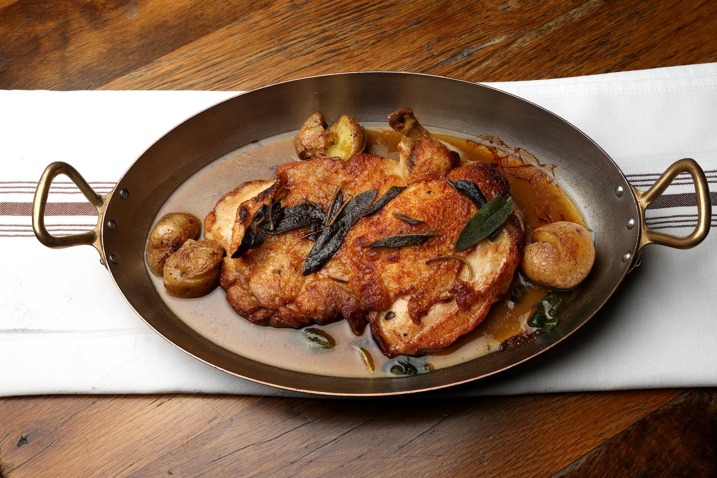 From the brick oven: chicken with crushed potatoes, brown butter, and sage.