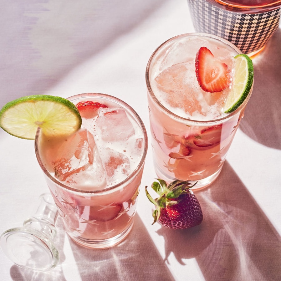strawberry fizz cocktails with a lime