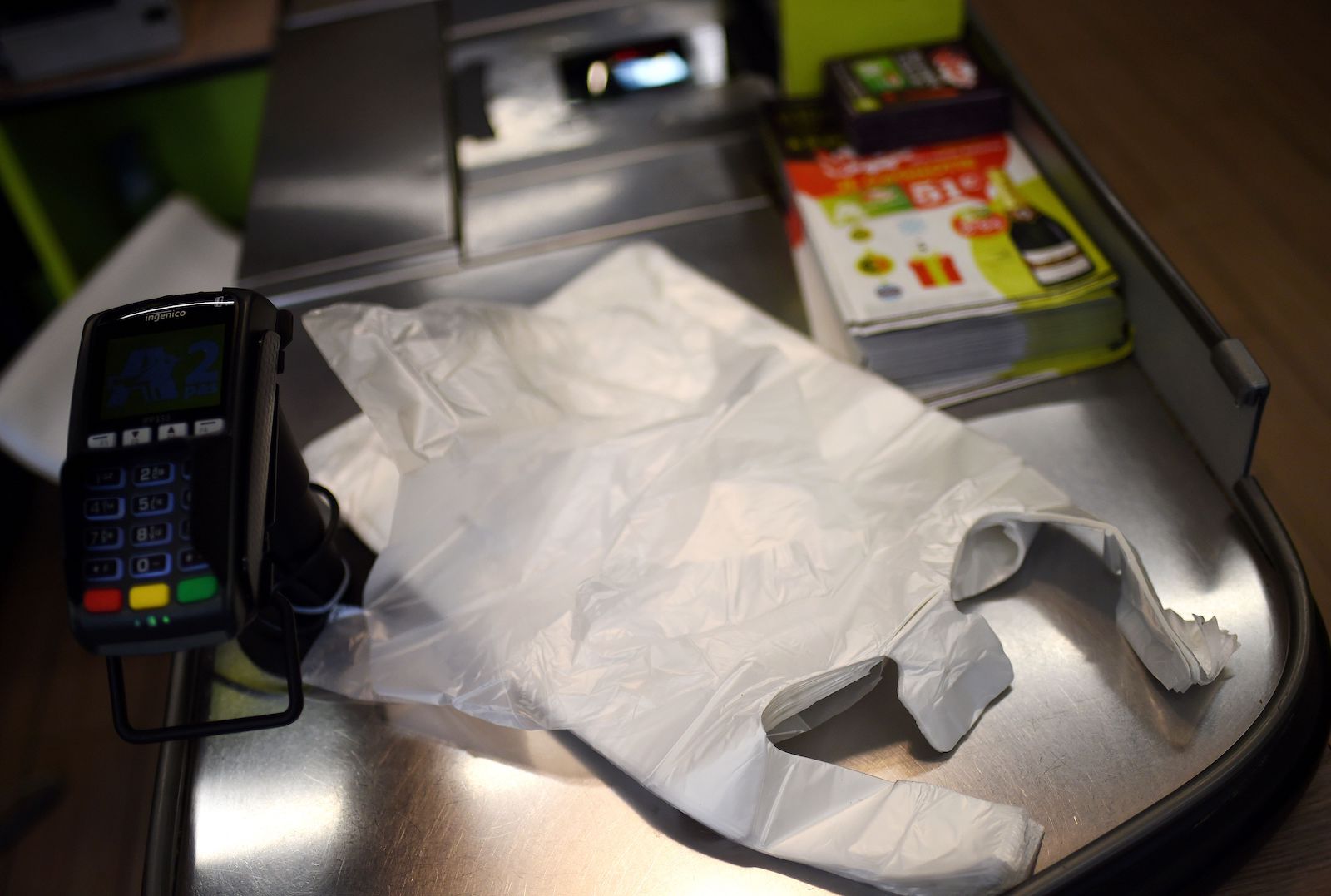 a stack of plastic bags in a grocery check out area