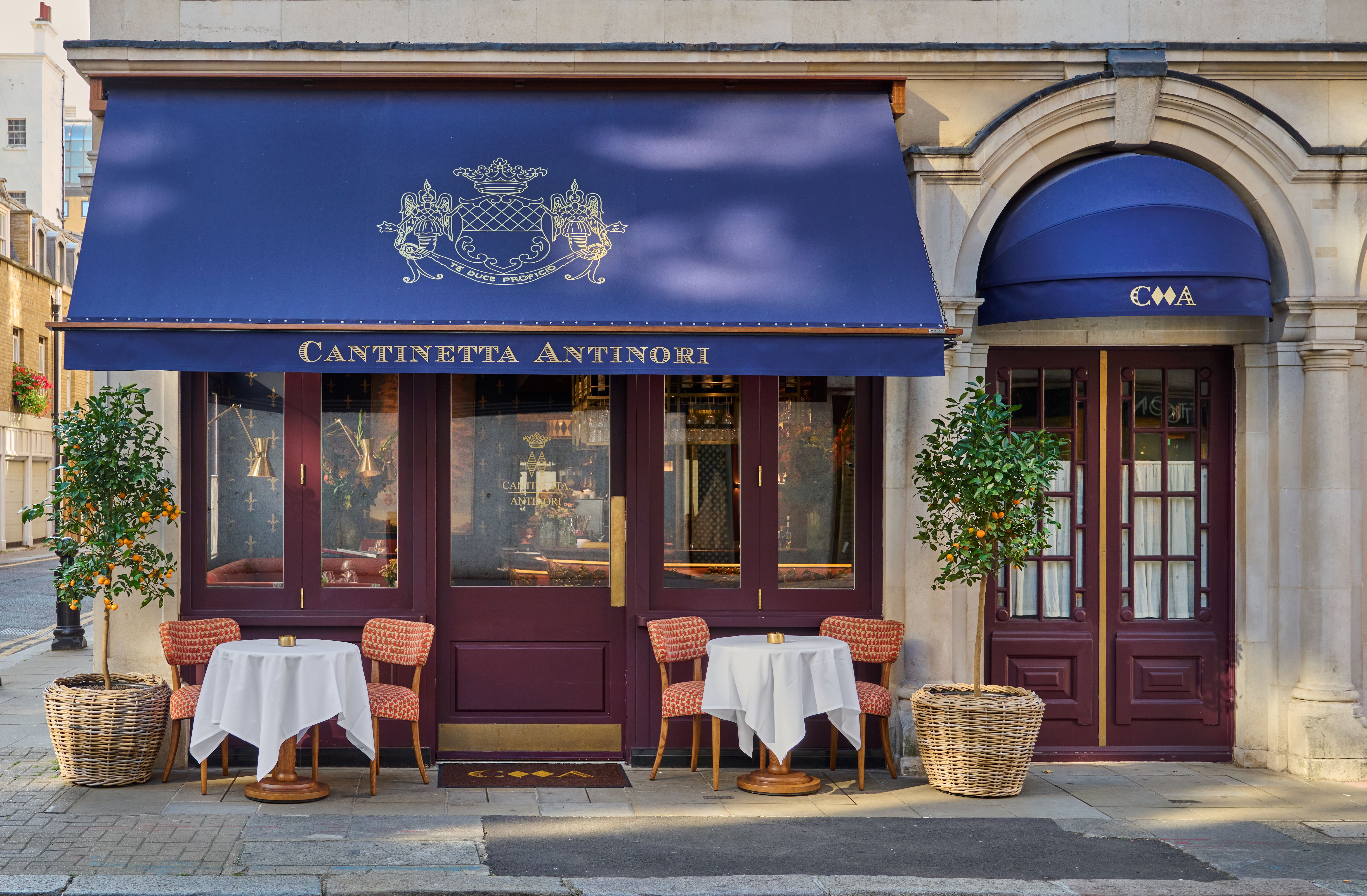 Cantinetta Antinori restaurant exterior in London, with two tables outside