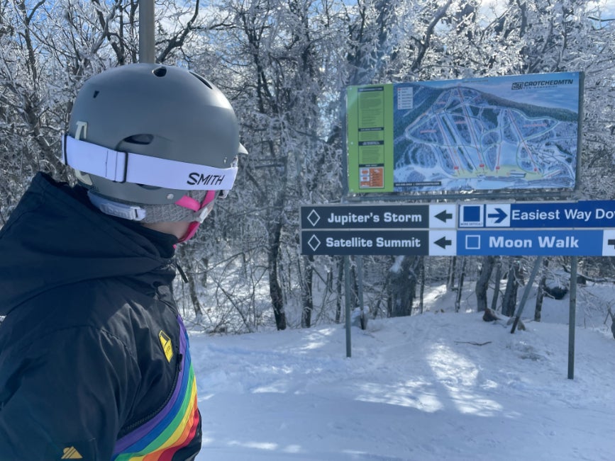 A young skier checks the trail map at Crotched Mountain, NH