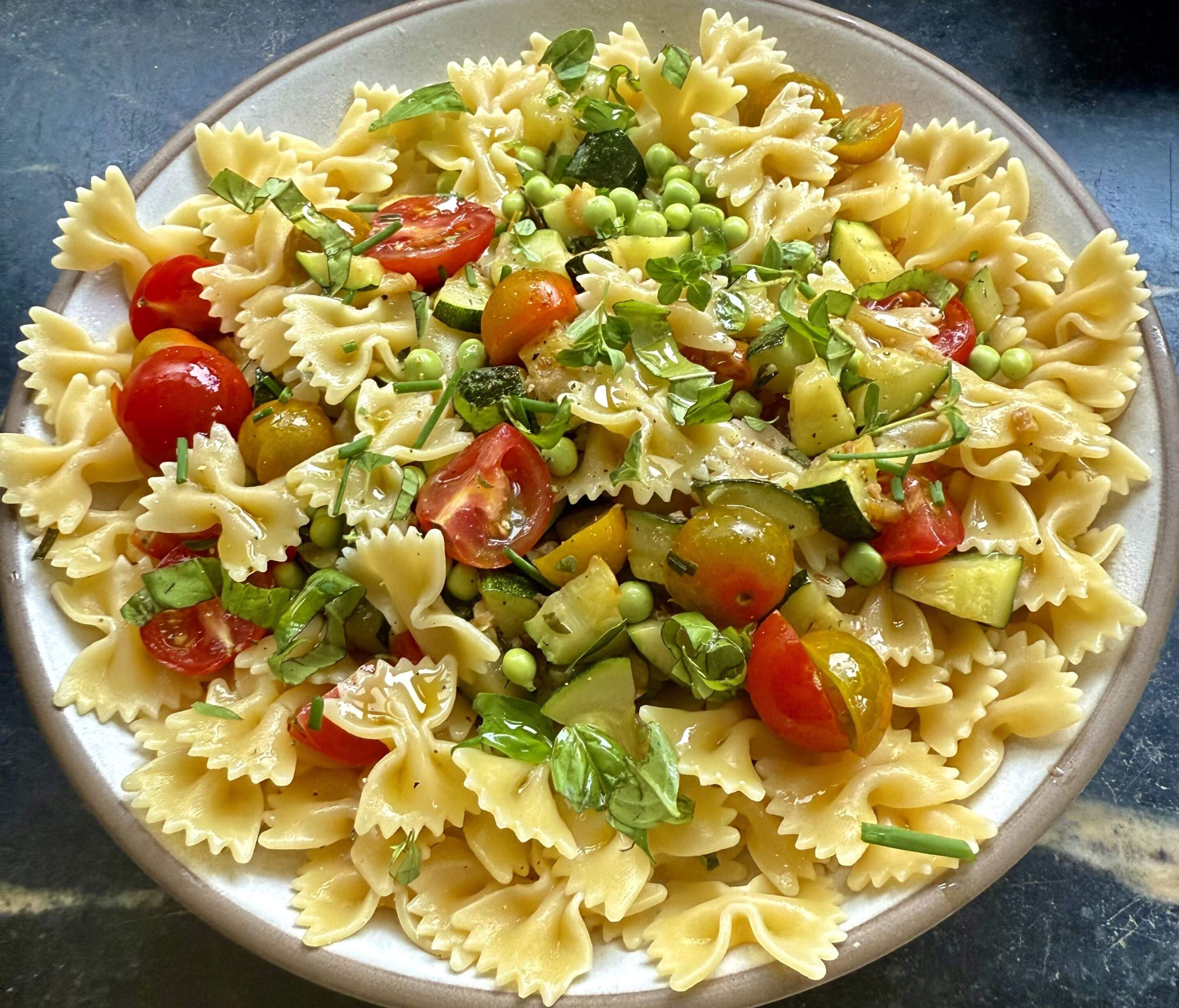 Summer pasta with zucchini, garlic, peas and tomatoes. (Kathy Gunst/Here & Now)