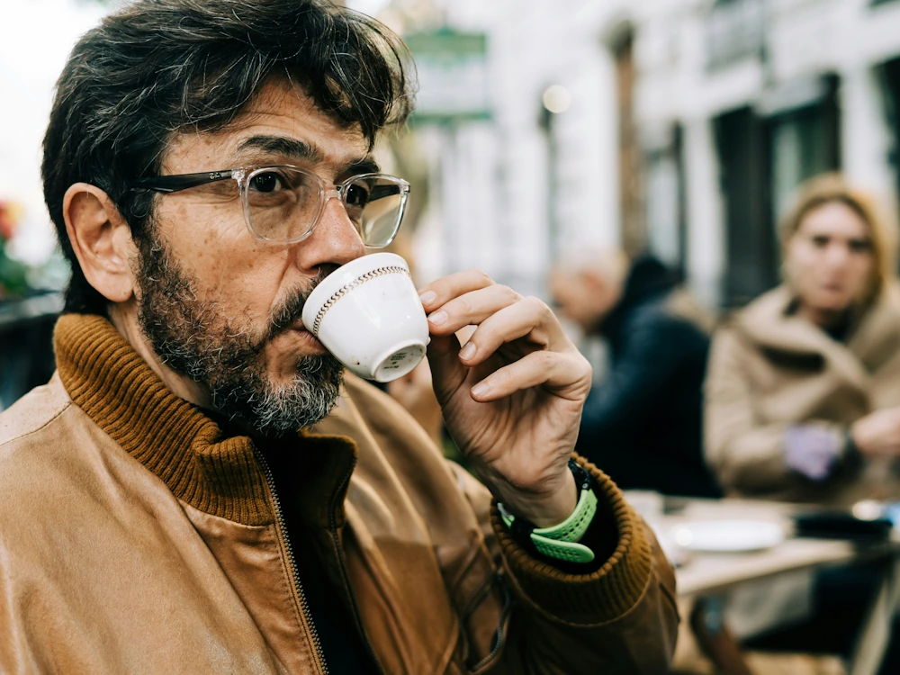 Italian man drinking espresso.