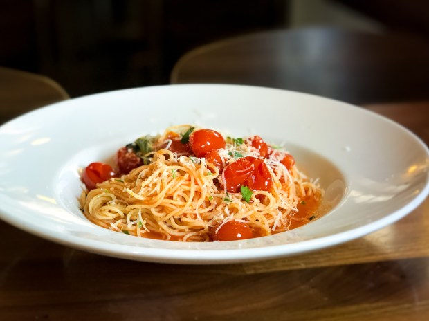 Pasta served many ways, including capellini with cherry tomatoes, is...