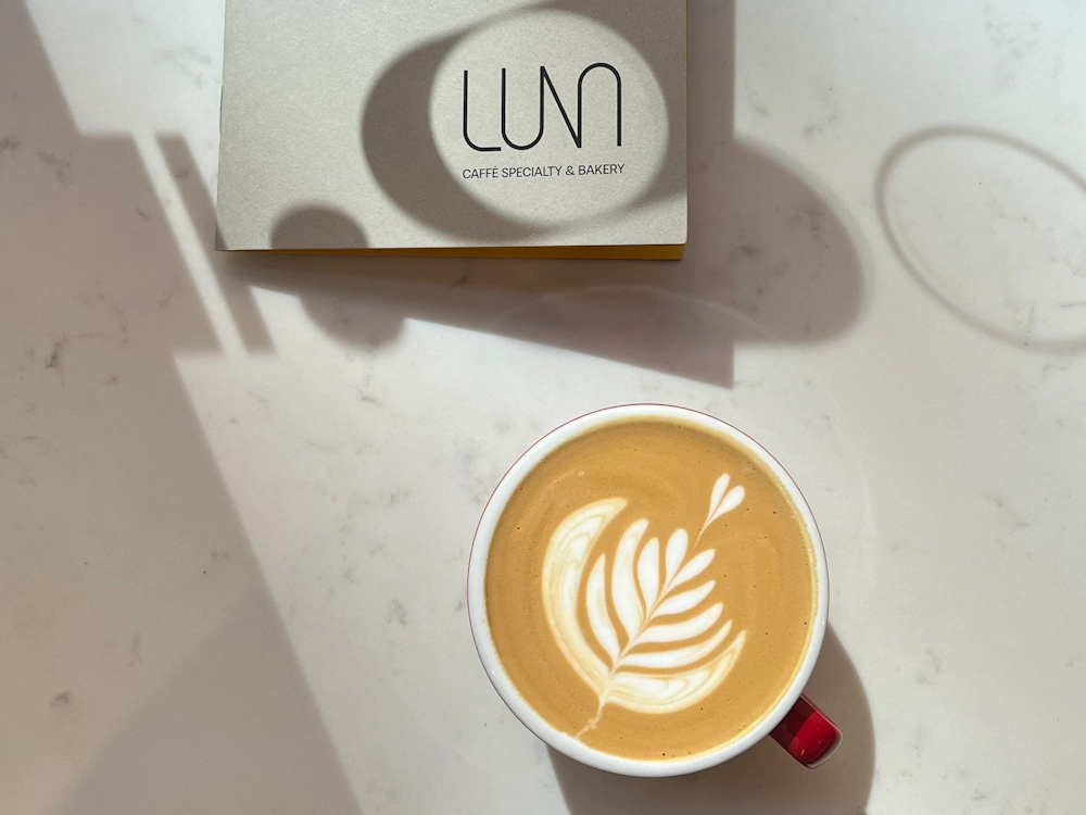 Luna menu and milk-based coffee drink.