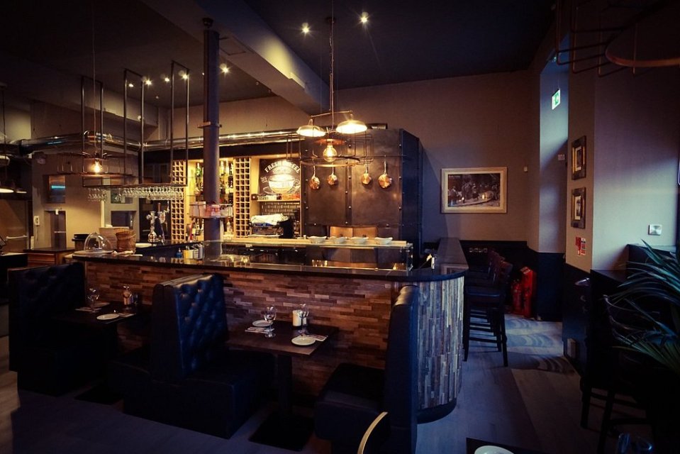 Interior view of a restaurant with a bar.