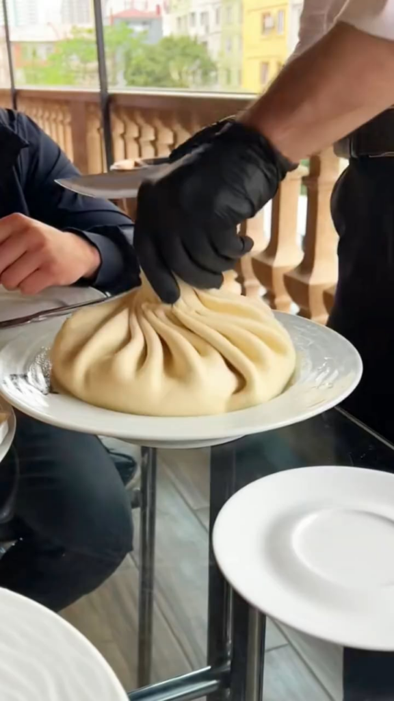 a giant bao filled with mini baos