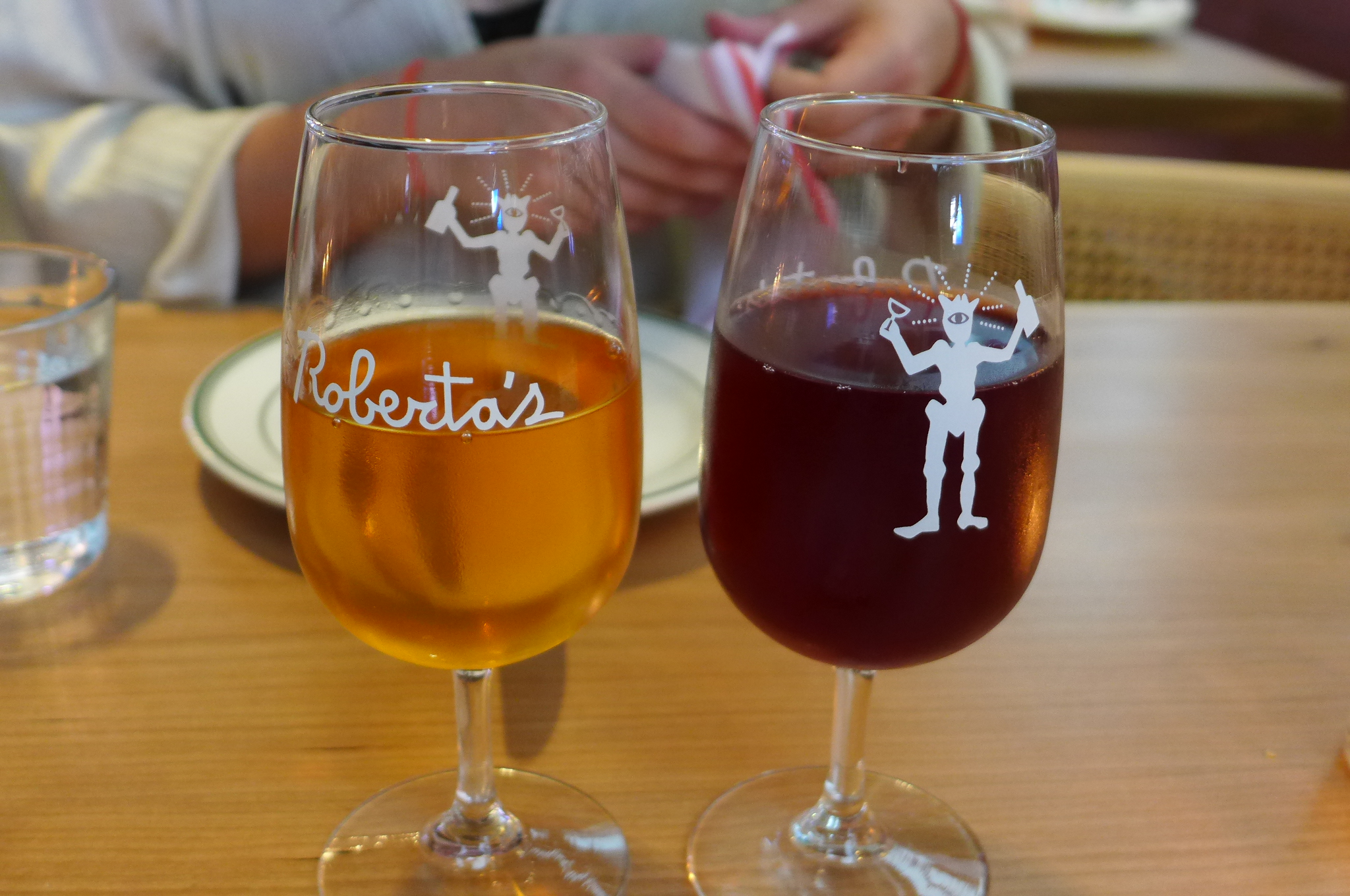 An orange and a red glass of wine.