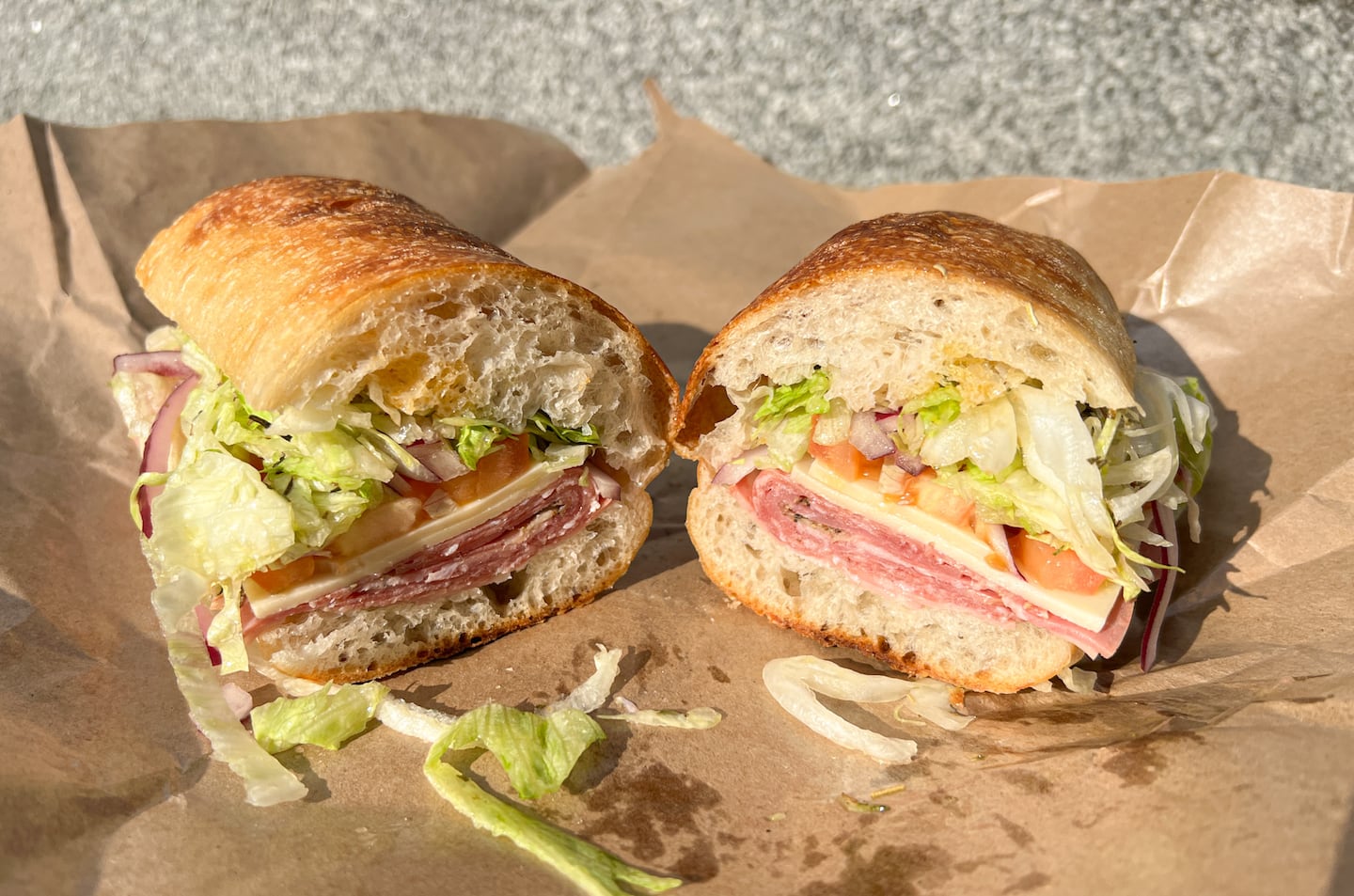The Italiano from Salumeria Italiana in the North End: salami, provolone, lettuce, tomato, hot peppers, olive oil, wine vinegar.