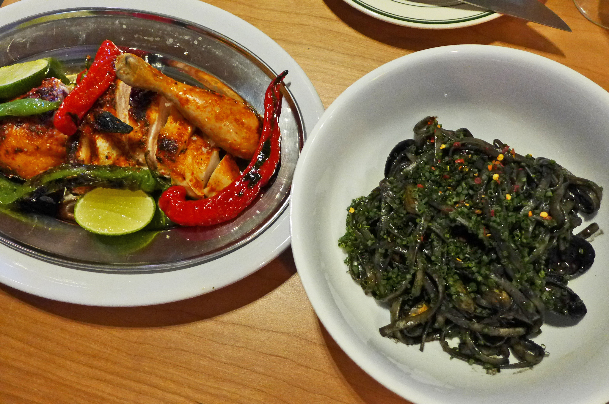 Red chicken and black pasta.