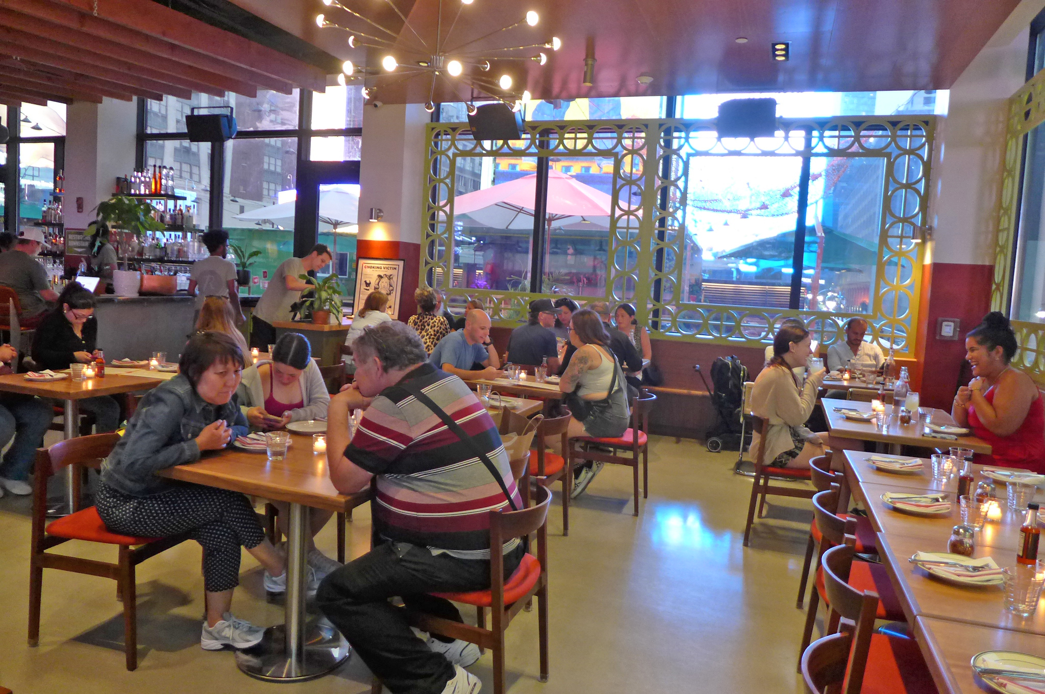 A room filled with tables with light streaming in from outside.
