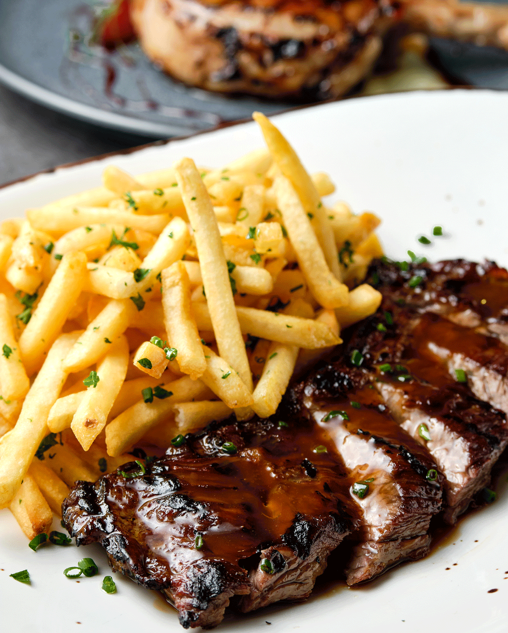 At Steak & Grace, find an 8-ounce hanger steak with herb fries for under $30.