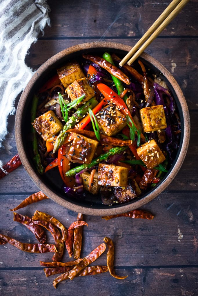 szechuan tofu and veggies with sesame seeds and sliced scallions and chilies.