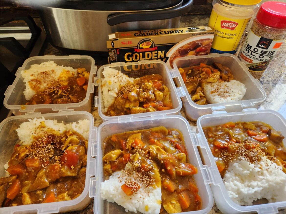 Japanese curry with chicken, bell pepper, carrot and onion over rice. Sprinkled with dried garlic and sesame seeds. Less than $2 per serving!