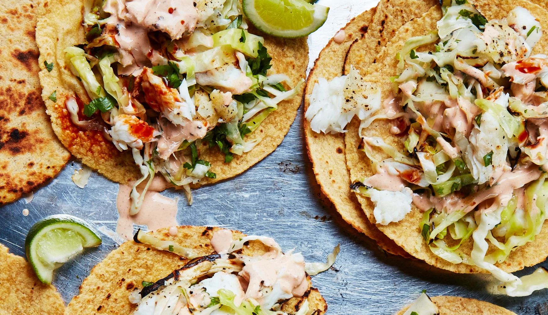 A photo shows Mark Bittman’s baja-style grilled fish tacos