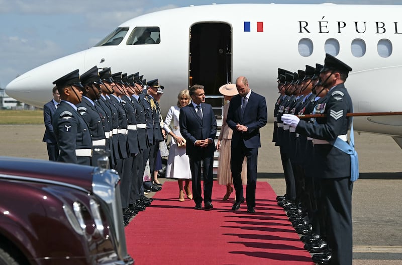 France's President Emmanuel Macron and his wife Brigitte Macron had an awkward encounter on arrival in the U.K.