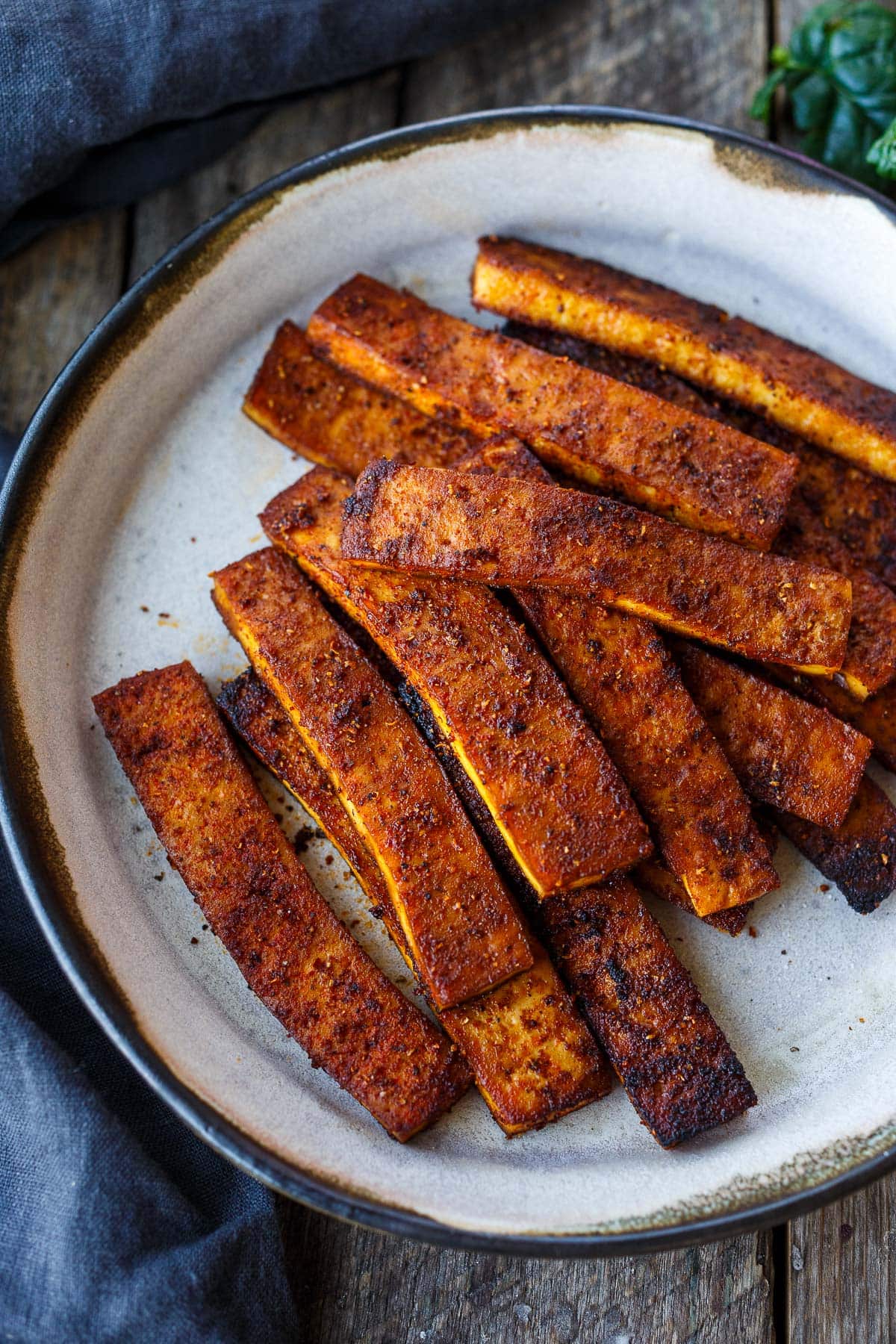 Crispy tofu bacon on a plate.