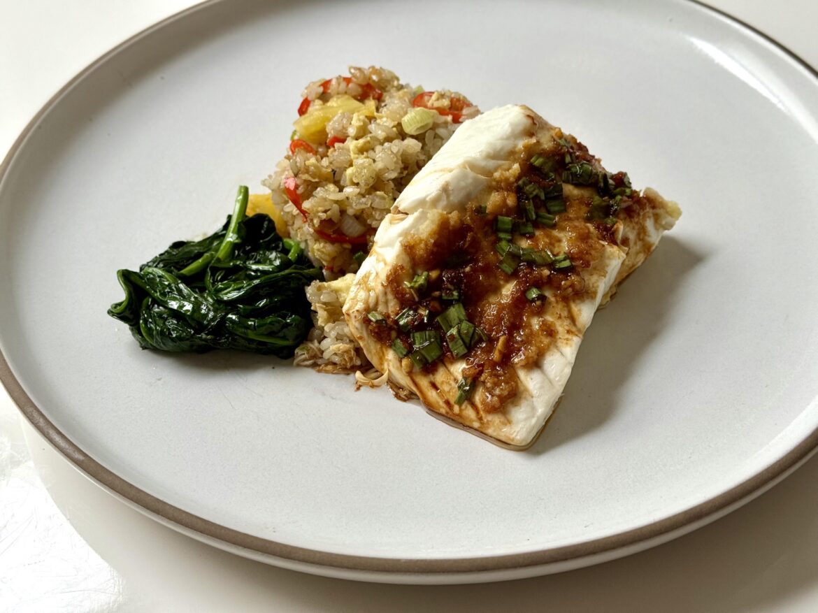 Steamed halibut with ginger and scallions, sautéed spinach, pineapple fried rice