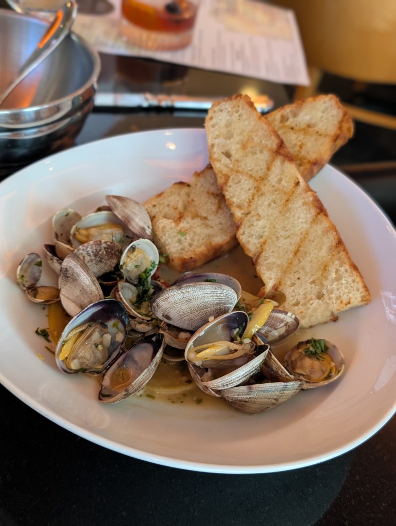 clams and bread in a bowl