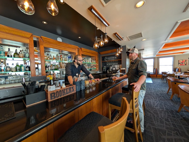 Zest Bartender Brent Bumpus and a customer at the bar