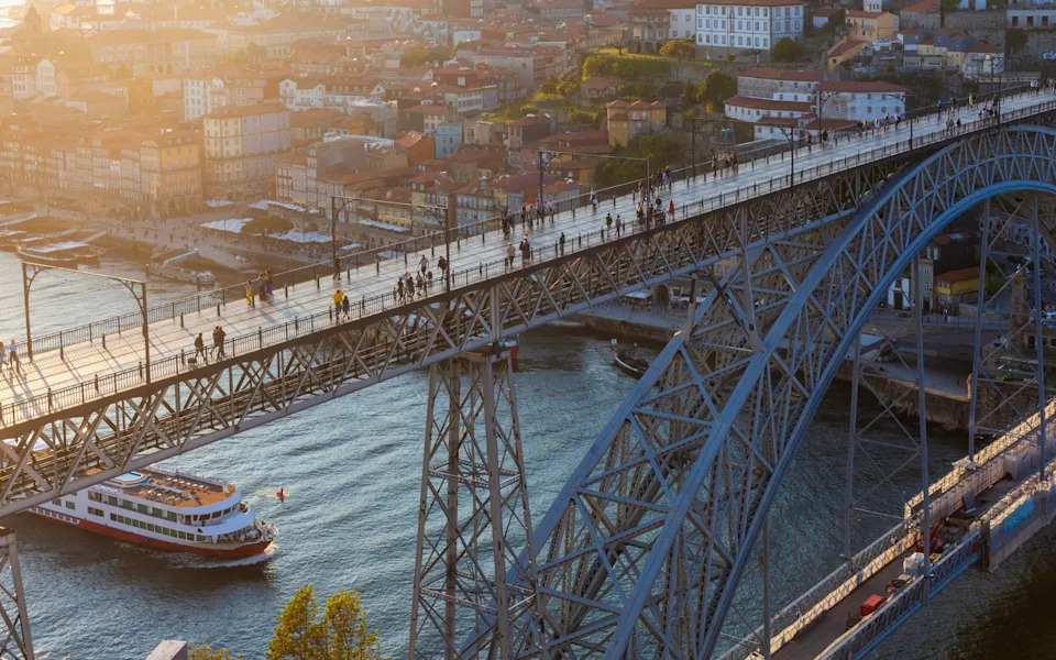 People walking on Dom Luis I Bridge aerial view, Porto, Portugal