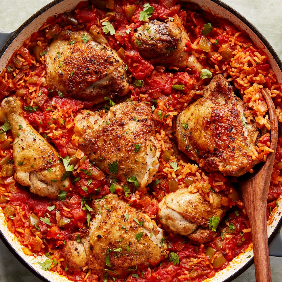 chicken thighs and legs in a tomato based rice