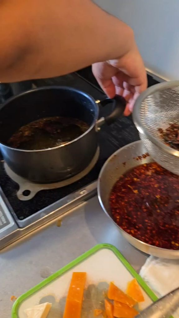 Pouring homemade chili oil