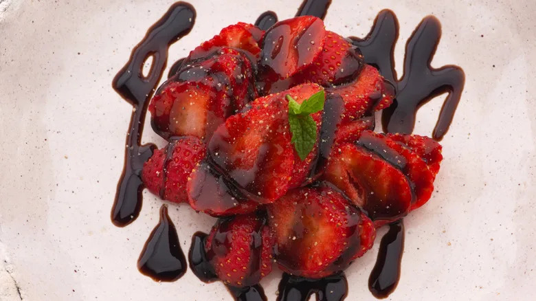 top down view of strawberries with balsamic and mint