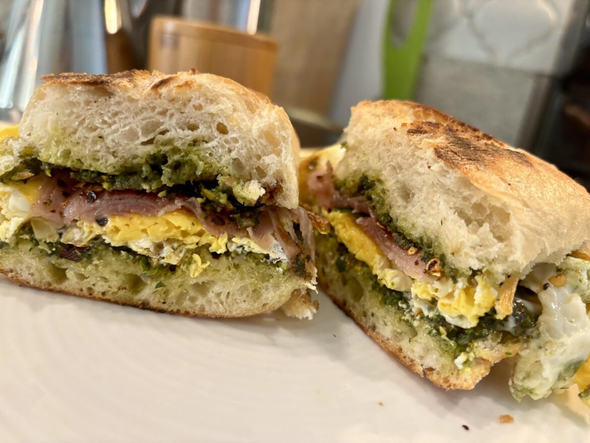 Made a new breakfast sandwich! Grilled ciabatta with homemade pesto, prosciutto, balsamic, chili flakes, and egg.