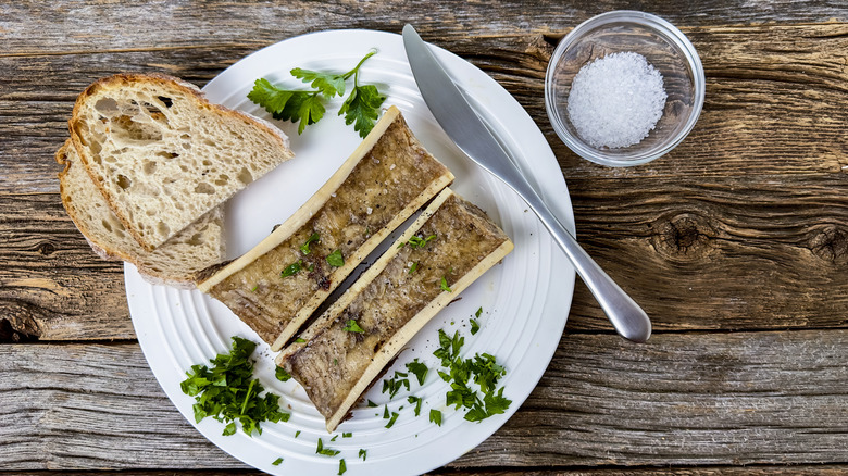 Roast bone marrow and bread on plate