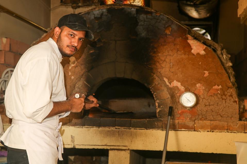 Building their own pizza oven was an adventure for La Risata’s owners but they persevered until they succeeded. — Picture by Choo Choy May