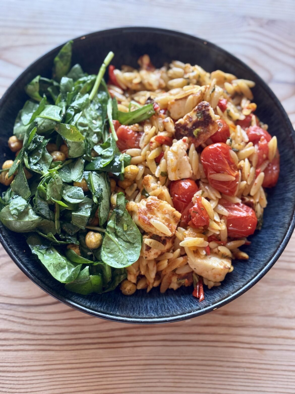 Roast tomato and red pepper basil halloumi orzo with a za’atar chickpea spinach salad.