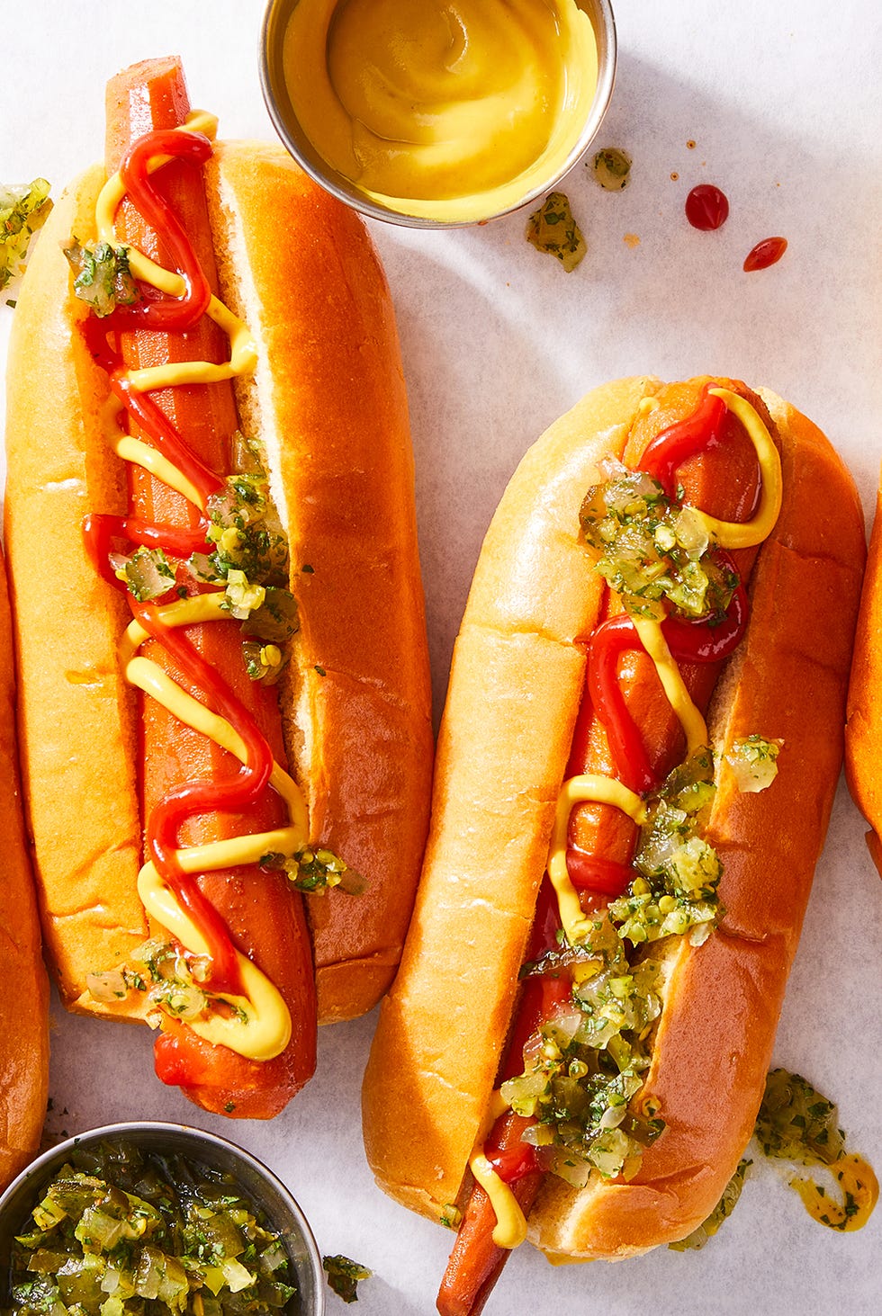 carrots in a hotdog bun with mustard, ketchup, and relish