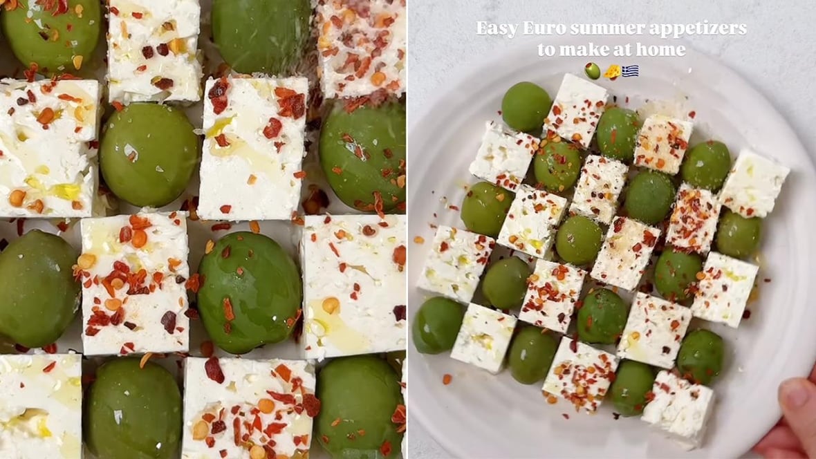 closeups on a plate with cubes of feta and olives in a checkerboard pattern. 